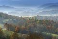 Autumn Colors and a Fog Mist over the Valley Royalty Free Stock Photo