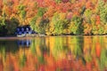 Autumn colors and fog reflections on the lake, Quebec Royalty Free Stock Photo