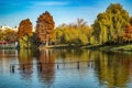 Autumn colors landscape scenery with trees and beautiful reflexions by the lake in the park