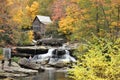 Autumn Colors, Old Mill, Bridge, and Flowing Water Over a Creek Royalty Free Stock Photo