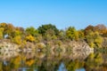 Autumn colors in sunny day on lake in city park. Landscape golden foliage. Royalty Free Stock Photo