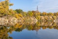 Autumn colors in sunny day on lake in city park. Landscape golden foliage. Royalty Free Stock Photo