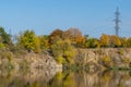 Autumn colors in sunny day on lake in city park. Landscape golden foliage. Royalty Free Stock Photo