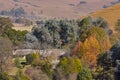 Autumn colours and farmhouse near Underberg in the Drakensberg mountain range in South Africa Royalty Free Stock Photo