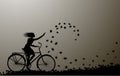 Autumn come, girl riding on the bicycle and autumn leaves swirling, silhouette, black and white,