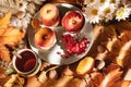 Autumn composition. Baked apples with cottage cheese, cranberries, tea and leaves on the table