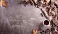 Autumn composition. A cup of coffee, cotton flowers, autumn leaves and scarft on dark stone background. Flat lay, top view with Royalty Free Stock Photo