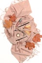 Autumn composition with dry maple leaves, brown scarf, glasses, women`s cosmetics and accessories Royalty Free Stock Photo