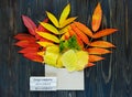 Autumn composition with envelope and leaves in it next to bars with names of months: september, october, november. Autumn