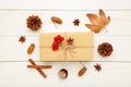 Autumn composition and gifts on white background. Pattern made of autumn leaves, acorn, pine cones