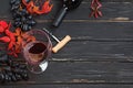 Autumn composition with glass of red wine, grapes and red leaves Royalty Free Stock Photo