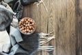 Autumn composition with hazelnuts in a glass jar on a wooden background next to a blanket. Organic hazelnut. Horizontal