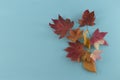 Autumn composition. Autumn leaves on blue background. Flat lay, top view, copy space