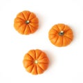 Autumn composition of little orange pumpkins isolated on white table background. Fall, Halloween and Thanksgiving