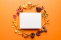 Autumn composition with paper blank and dried leaves on table. Flat lay, top view, copy space Royalty Free Stock Photo