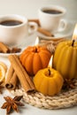 Autumn composition.Pumpkin candles,spicy star anise spices and cinnamon on a wooden background. Royalty Free Stock Photo