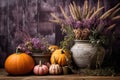 Autumn composition of pumpkin, heather and colorful flowers in pots