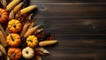 Autumn composition with pumpkins and corn on wooden background. Top view with copy space Royalty Free Stock Photo