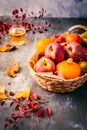 Autumn composition with pumpkins, autumn leaves, red apples and apple cider Royalty Free Stock Photo