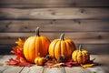 Autumn composition of pumpkins and maple leaves on wooden background. Generative AI Royalty Free Stock Photo
