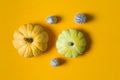 Autumn composition. Pumpkins on yellow background. Autumn, halloween concept. Flat design, top view