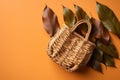 Autumn composition. Straw bag with autumn dried leaves on green background. Flat lay. Top view. Copy space. Fall season Royalty Free Stock Photo