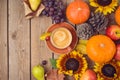 Autumn concept with pumpkin, apples and sunflowers on wooden table. Thanksgiving holiday background. Top view from above Royalty Free Stock Photo