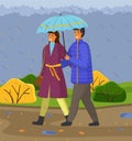 Autumn, couple of happy girl and guy with umbrella hugging walking in park under falling rain Royalty Free Stock Photo