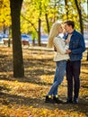 Autumn couple walking park. Friends walk outdoor. Royalty Free Stock Photo