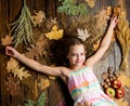 Autumn coziness is just around. Tips for turning autumn into best season. Kid girl smiling face relax wooden background