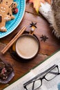 Autumn cozy composition with coffe and book at wooden table. life style concept. flat lay