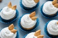 Autumn cupcakes decorated with cream and cookies leaves on gray wooden background. Soft focus. Thanksgiving day or Halloween Royalty Free Stock Photo