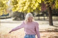 Happy young woman enjoying in the park