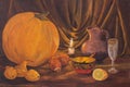 Autumn dark Thanksgiving concept with pumpkins, pear, onions, lemon, bowl, wine glass, jug and burning candles on table