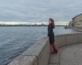 Autumn day an attractive girl by the river Royalty Free Stock Photo