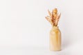 Autumn decor dried flowers in yellow wooden vase on white background. copy space Royalty Free Stock Photo