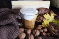 Autumn decorated desk with cup of espresso coffee