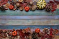 Autumn decorations on table with leaves, pumpkins, pine cones on colorful background. Copy space for text or seasonal offer.