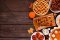 Autumn desserts side border with a variety of traditional fall treats, overhead view on a wood background