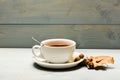 Autumn drink concept. Drink and acorn and oak leaves. Mug filled with black brewed tea, spoon and autumn fallen leaves Royalty Free Stock Photo