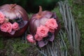 Autumn DÃÂ©cor with bouquet of roses and grapes in the golden pumpkin. Stylish Halloween decorations. Shiny Decorative Pumpkins.