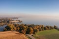 Autumn empty road near the lake and trees. Road on a sunny day in the countryside in Poland Royalty Free Stock Photo