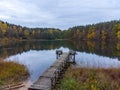 Autumn evening by the lake,old wooden bridge. Royalty Free Stock Photo