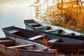 Autumn evening on a deserted river bank with three fishing boats on the bank. nobody Royalty Free Stock Photo