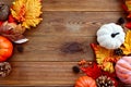 Autumn, fall abstract frame composition with colorful leaves, pine cones and pumpkins onwooden background, copy space Royalty Free Stock Photo