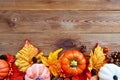 Autumn, fall abstract frame composition with colorful leaves, pine cones and pumpkins onwooden background, copy space Royalty Free Stock Photo