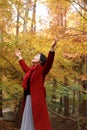 Autumn / fall beautiful woman happy in free freedom pose in autumn park Royalty Free Stock Photo