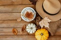 Autumn fall composition. Wooden desk table with knitted sweater,