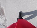 Autumn fall concept . Close up of woman feet walking in red boots Royalty Free Stock Photo