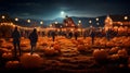 Autumn fall festival with lights, pumpkins and people on a pumpkin patch farm. Royalty Free Stock Photo